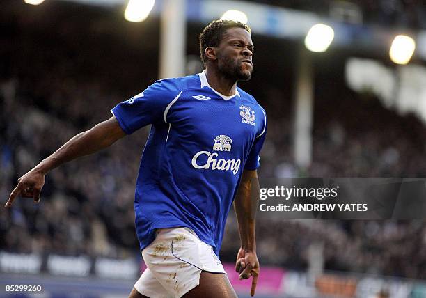 Everton's French forward Louis Saha celebrates after scoring the team's second goal during their FA cup quarter final football match against...