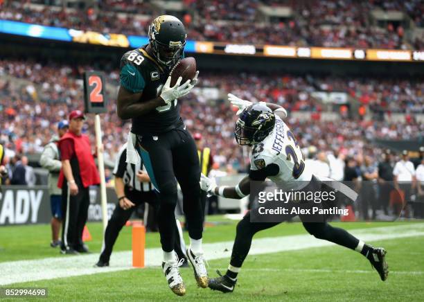 Marcedes Lewis of the Jacksonville Jaguars scores a touchdown during the NFL International Series match between Baltimore Ravens and Jacksonville...