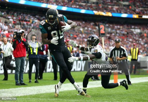 Marcedes Lewis of the Jacksonville Jaguars scores a touchdown during the NFL International Series match between Baltimore Ravens and Jacksonville...