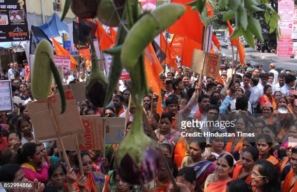 Shiv Sena supporters protest against BJP government for the rising prices of fuel, vegetables and food grains at Kandivali, on September 23, 2017 in...
