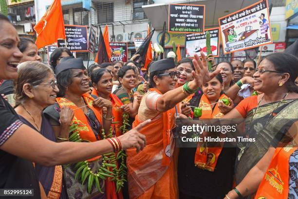 Shiv Sena activists protest against BJP government for the rising prices of petrol and diesel at Kurla, on September 23, 2017 in Mumbai, India. The...