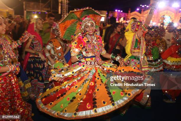 Women perform dandiya dance at "Thane Raas Rang Navratri Festival" at Modella Mill Compound, Thane, on September 23, 2017 in Mumbai, India. Dandiya...