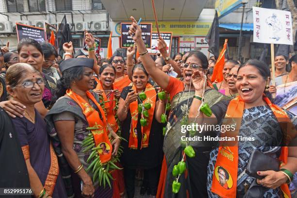 Shiv Sena activists protest against BJP government for the rising prices of petrol and diesel at Kurla, on September 23, 2017 in Mumbai, India. The...