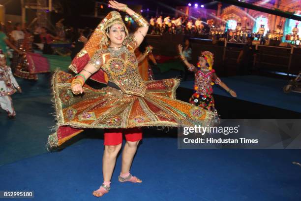 Women perform dandiya dance at "Thane Raas Rang Navratri Festival" at Modella Mill Compound, Thane, on September 23, 2017 in Mumbai, India. Dandiya...