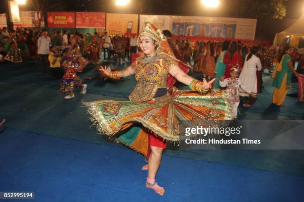 Women perform dandiya dance at "Thane Raas Rang Navratri Festival" at Modella Mill Compound, Thane, on September 23, 2017 in Mumbai, India. Dandiya...