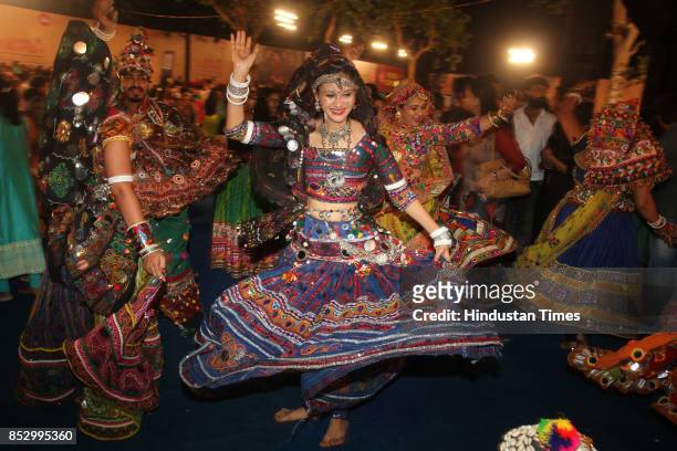 Women perform dandiya dance at "Thane Raas Rang Navratri Festival" at Modella Mill Compound, Thane, on September 23, 2017 in Mumbai, India. Dandiya...