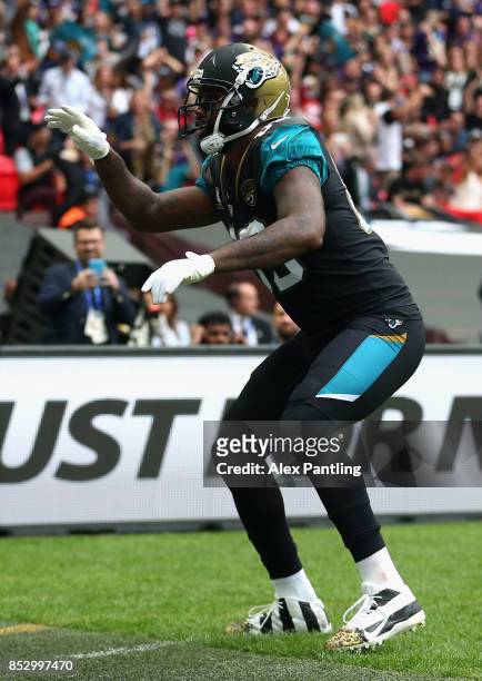 Marcedes Lewis of the Jacksonville Jaguars celebrates after scoring a touchdown during the NFL International Series match between Baltimore Ravens...