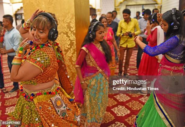 Women enjoy Silent garba dance at Rai Mahal Banquet, Malad, on September 19, 2017 in Mumbai, India. Rajmahal Banquets in Malad West has introduced...