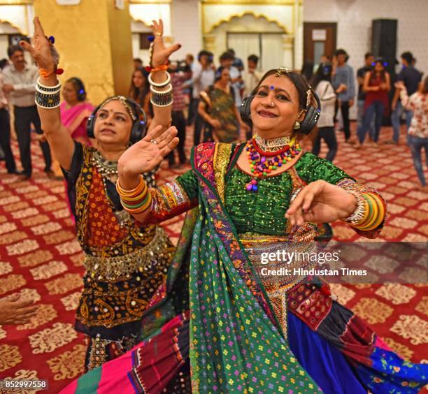 Women enjoy Silent garba dance at Rai Mahal Banquet, Malad, on September 19, 2017 in Mumbai, India. Rajmahal Banquets in Malad West has introduced...