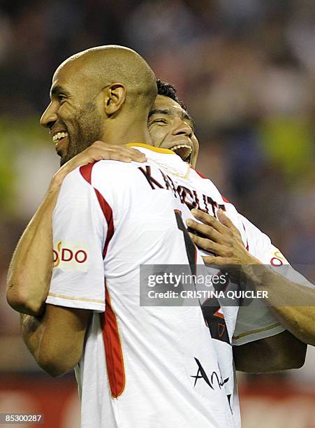 Sevilla's Renato Dirnei celebrates after scoring with Frederic Kanoute against Almeria during their Spanish league football match against Almeria at...