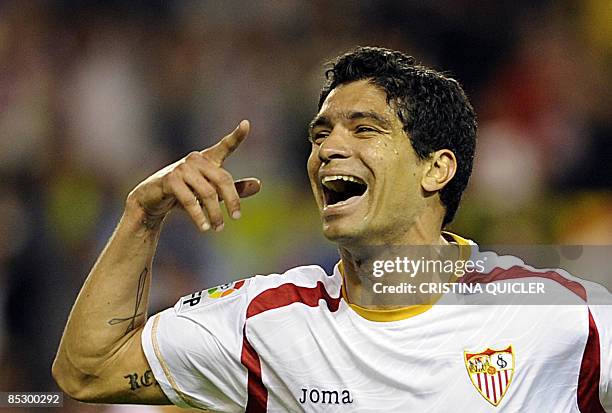 Sevilla's Renato Dirnei celebrates after scoring against Almeria during their Spanish league football match against Almeria at Sanchez Pizjuan...