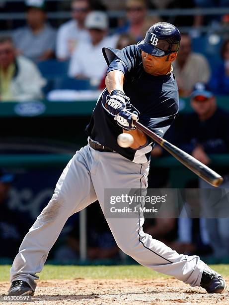 First baseman Carlos Pena of the Tampa Bay Rays fouls off a pitch against the Boston Red Sox during a Grapefruit League Spring Training Game at City...
