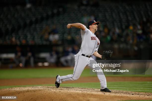 Luke Gregerson of the Houston Astros pitches during the game against the Oakland Athletics at the Oakland Alameda Coliseum on September 8, 2017 in...