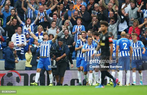 Tomer Hemed of Brighton and Hove Albion celebrates as he scores their first goal during the Premier League match between Brighton and Hove Albion and...