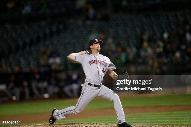 Luke Gregerson of the Houston Astros pitches during the game against the Oakland Athletics at the Oakland Alameda Coliseum on September 8, 2017 in...