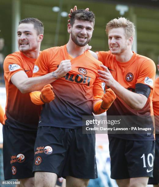 Dundee United's Nadir Ciftci celebrates his goal with team-mates Paul Paton and Stuart Armstrong during the Scottish Cup, Fifth Round match at...