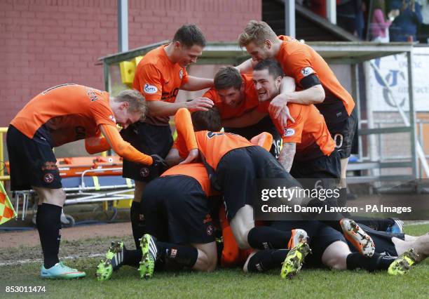 Dundee United's Nadir Ciftci celebrates his goal with teams during the Scottish Cup, Fifth Round match at Tannadice Park, Dundee.