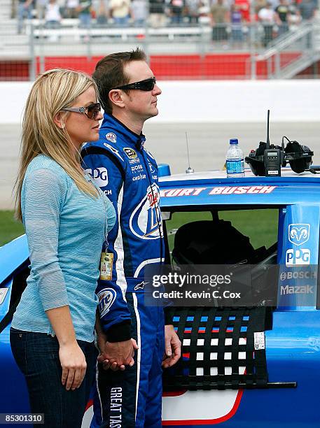 Kurt Busch, driver of the Miller Lite Dodge, and his wife Eva stand on pit road prior to the start of the NASCAR Sprint Cup Series Kobalt Tools 500...