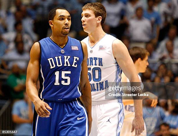 Gerald Henderson of the Duke Blue Devils walks by Tyler Hansbrough of the North Carolina Tar Heels during their game at the Dean E. Smith Center on...