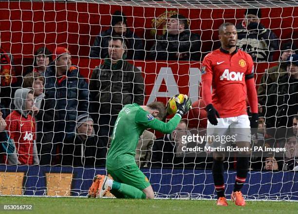 Manchester United goalkeeper David De Gea looks dejected after Fulham's Darren Bent scores in the final few minutes of the game