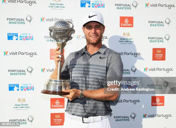 Lucas Bjerregaard of Denmark celebrates victory with the trophy during day four of the Portugal Masters at Dom Pedro Victoria Golf Club on September...