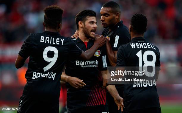 Kevin Volland of Bayer Leverkusen celebrates with team mates after scoring his teams first goal during the Bundesliga match between Bayer 04...