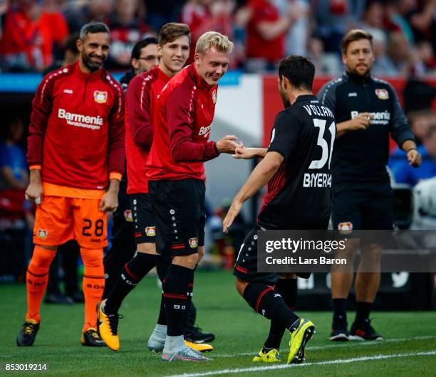 Kevin Volland of Bayer Leverkusen celebrates with team mates after scoring his teams first goal during the Bundesliga match between Bayer 04...