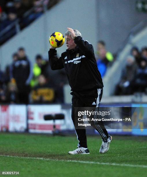 Hull City manager Steve Bruce pretends to throw in the ball from the touchline during the Barclays Premier League match at the KC Stadium, Hull.