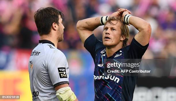 Stade Francais Paris' South African scrum half Charl Mcleod reacts during the French Top 14 rugby union match between Stade Francais and Toulon at...