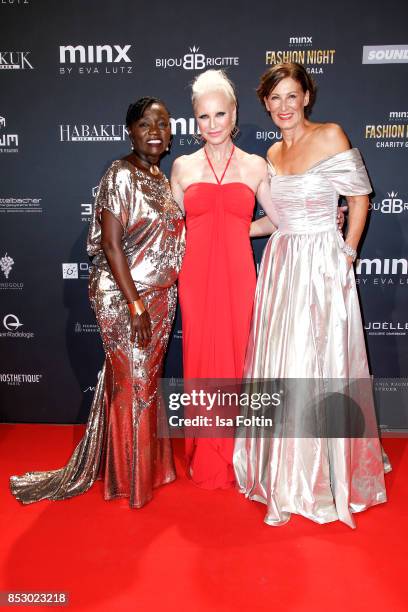 Auma Obama, halfsister of former US president Barack Obama, Opera singer Nadja Michael and Minx Designer Nadja Michael during the Minx Fashion Night...