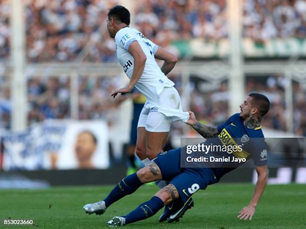 Dario Benedetto of Boca Juniors grabs Lautaro Gianetti of Velez Sarsfield during a match between Velez Sarsfield and Boca Juniors as part of the...