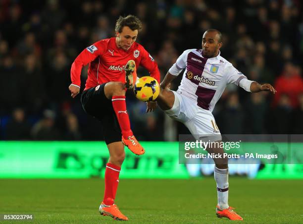 Aston Villa's Fabian Delph and Cardiff City's Magnus Wolff Eikrem battle for the ball during the Barclays Premier League match at the Cardiff City...