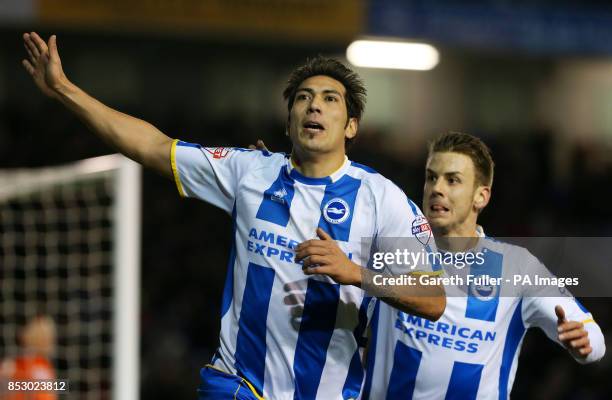 Brighton's Leonardo Ulloa celebrates his goal with Solly March during the Sky Bet Championship at The AMEX Stadium, Brighton.