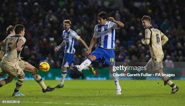 Brighton's Leonardo Ulloa shoots and scores for during the Sky Bet Championship at The AMEX Stadium, Brighton.