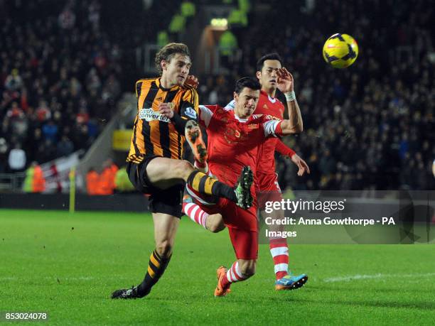 Hull City's Nikica Jelavic has a shot on goal under pressure from Southampton's Jose Fonte during the Barclays Premier League match at the KC...