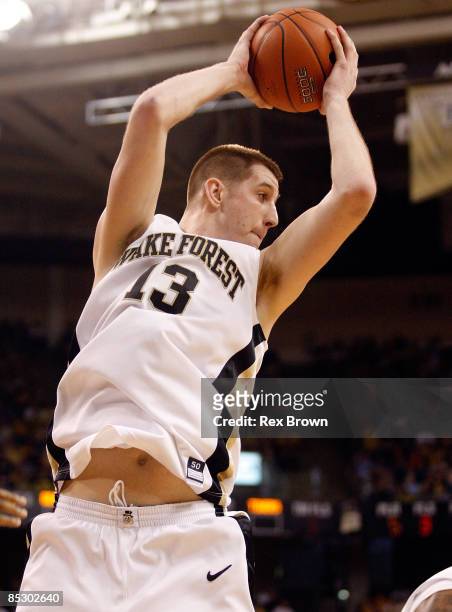 Chas McFarland of the Wake Forest Demon Deacons pulls down this rebound against the Clemson Tigers at Lawrence Joel Coliseum on March 8, 2009 in...