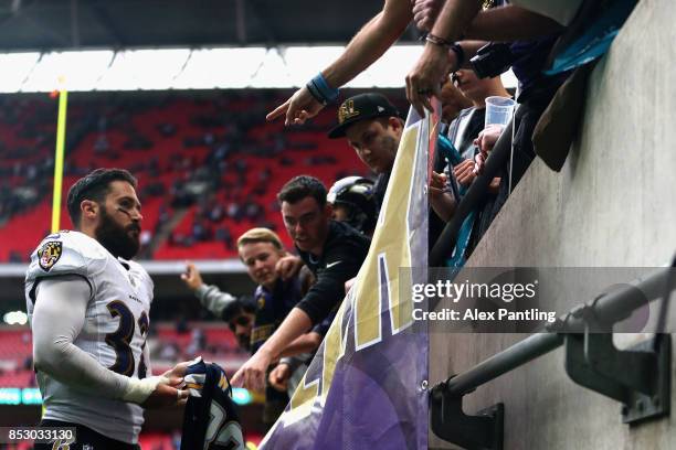 Eric Weddle of the Baltimore Ravens interacts with fans following the NFL International Series match between Baltimore Ravens and Jacksonville...