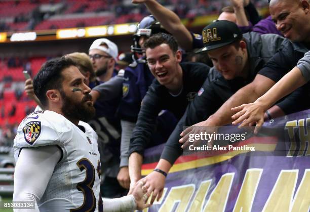 Eric Weddle of the Baltimore Ravens interacts with fans following the NFL International Series match between Baltimore Ravens and Jacksonville...