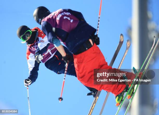 Great Britain's Rowan Cheshire narrowly avoids colliding with another competitor in the Women's Ski Halfpipe training during the 2014 Sochi Olympic...