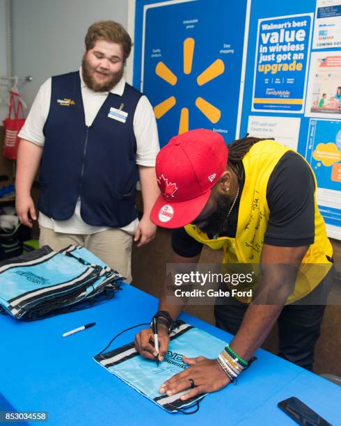 American football player Michael Griffin signs autographs and meets with customers to celebrate Being Active with Sports Illustrated Kids and Capri...