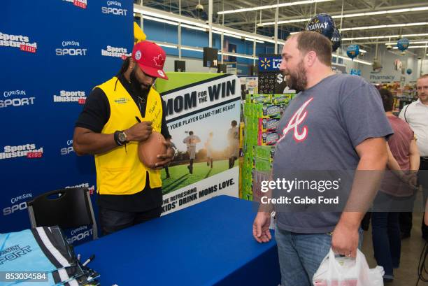 American football player Michael Griffin signs autographs and meets with customers at Walmart on September 23, 2017 in Hopkinsville, Kentucky.