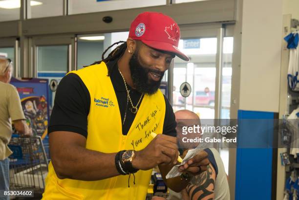 American football player Michael Griffin signs autographs and meets with customers to celebrate Being Active with Sports Illustrated Kids and Capri...