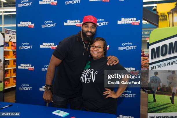 American football player Michael Griffin signs autographs and meets with customers at Walmart on September 23, 2017 in Hopkinsville, Kentucky.