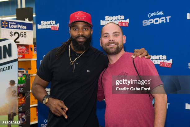 American football player Michael Griffin signs autographs and meets with customers at Walmart on September 23, 2017 in Hopkinsville, Kentucky.