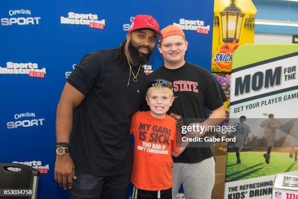 American football player Michael Griffin signs autographs and meets with customers at Walmart on September 23, 2017 in Hopkinsville, Kentucky.