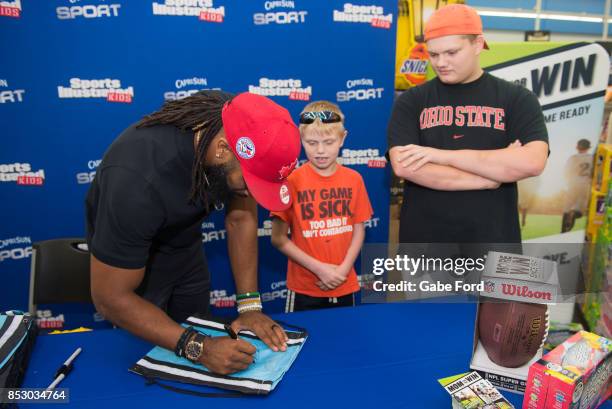 American football player Michael Griffin signs autographs and meets with customers at Walmart on September 23, 2017 in Hopkinsville, Kentucky.