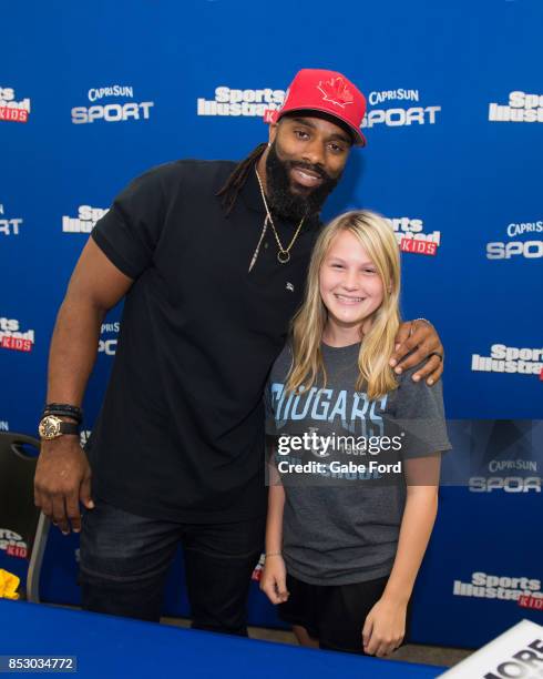 American football player Michael Griffin signs autographs and meets with customers at Walmart on September 23, 2017 in Hopkinsville, Kentucky.