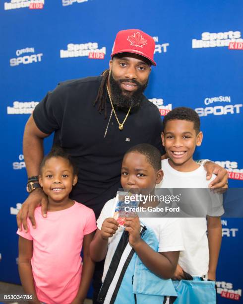 American football player Michael Griffin signs autographs and meets with customers at Walmart on September 23, 2017 in Hopkinsville, Kentucky.