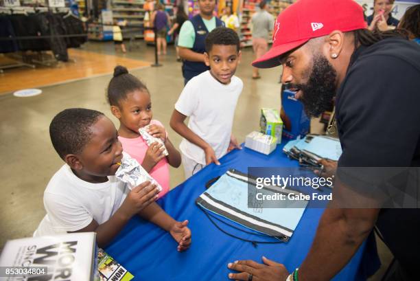 American football player Michael Griffin signs autographs and meets with customers at Walmart on September 23, 2017 in Hopkinsville, Kentucky.