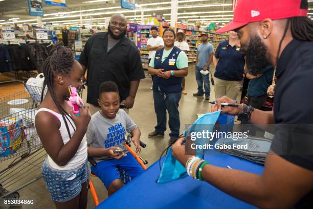 American football player Michael Griffin signs autographs and meets with customers at Walmart on September 23, 2017 in Hopkinsville, Kentucky.